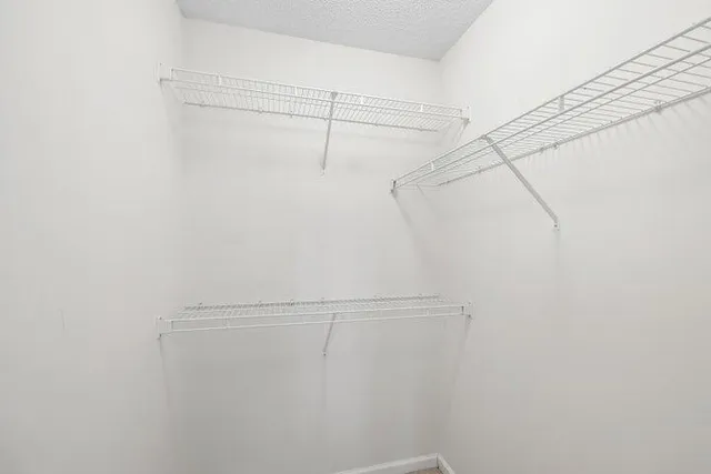 a view of a room with racks on the wall
