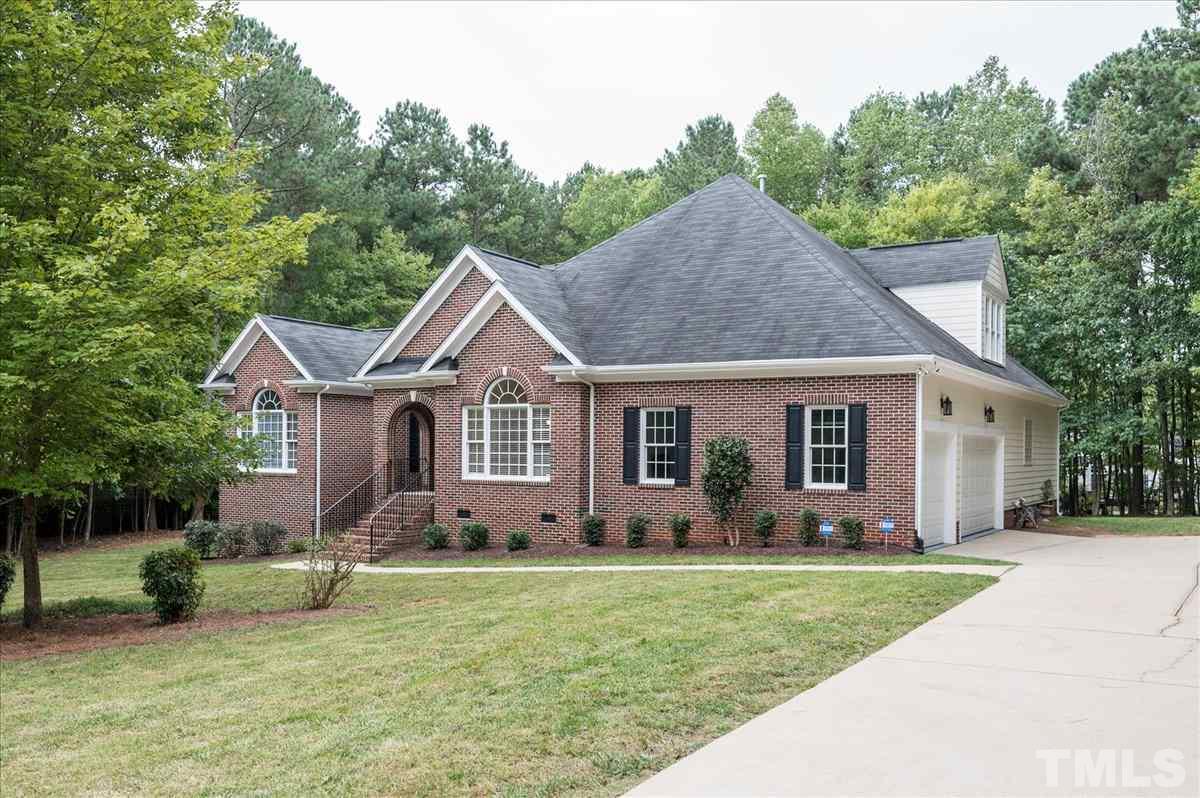 5245 Bartons Enclave Lane Raleigh, NC 27613 - Photo 1 of 27 Brick Front and Hardie Plank - Freshly painted exterior - 3 Car Epoxy floored Garage with side entry . Gorgeous private flat .95 acre lot. Deep covered porch entry . Whole House Kinetico Water Softener/Filtration