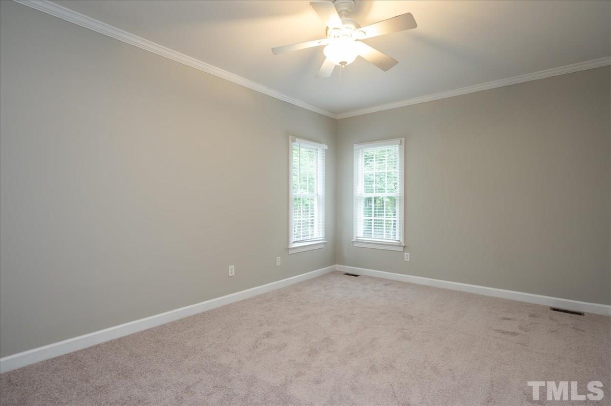 5245 Bartons Enclave Lane Raleigh, NC 27613 - Photo 17 of 27 1 of 3 main floor bedrooms. Views of the Backyard pool