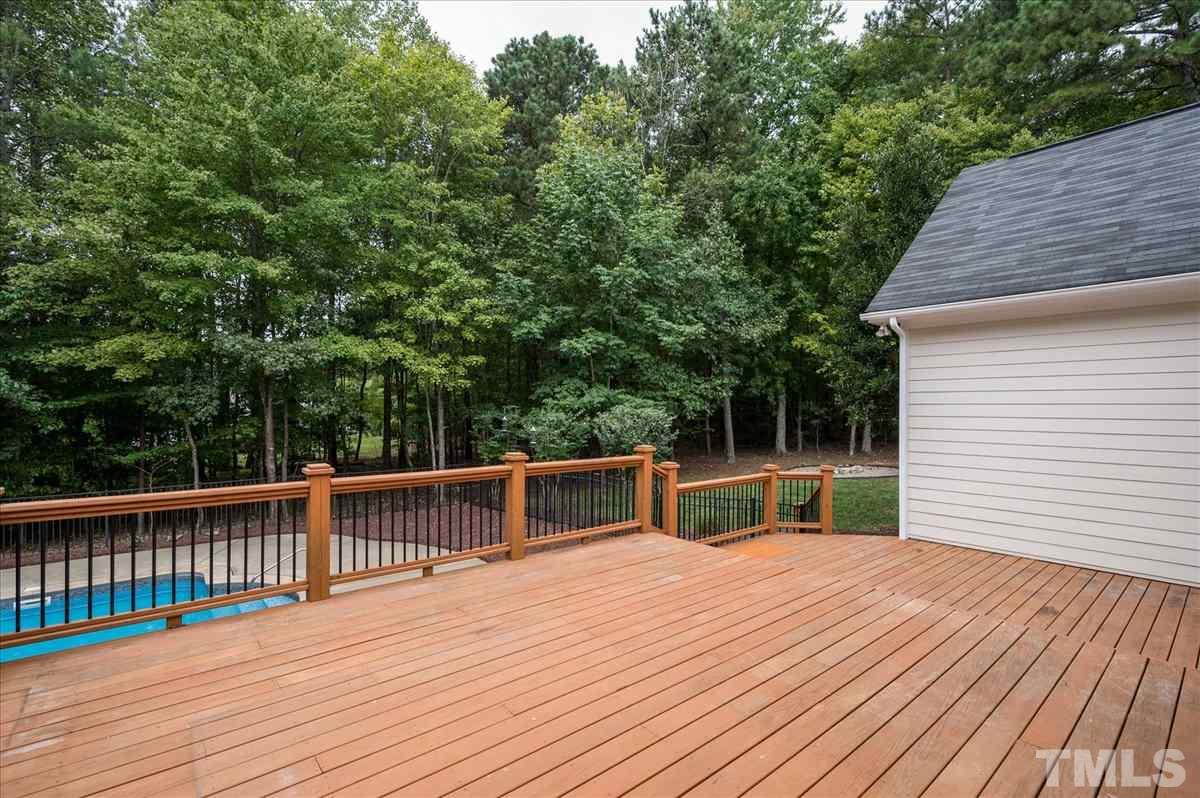 5245 Bartons Enclave Lane Raleigh, NC 27613 - Photo 23 of 27 Very large 2 tier deck accessed off of Family Room is perfect for all your entertaining needs. Spacious for outdoor dining, lounging, grilling.. Overlook the 41 x20 in ground Heated Saltwater Pool and private fenced backyard.