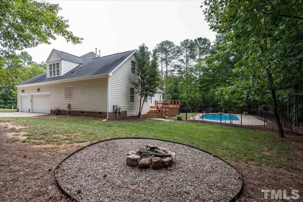 5245 Bartons Enclave Lane Raleigh, NC 27613 - Photo 25 of 27 Addtl area designated for fire pit. Invisible Dog Fencing for front and left facing side of yard.