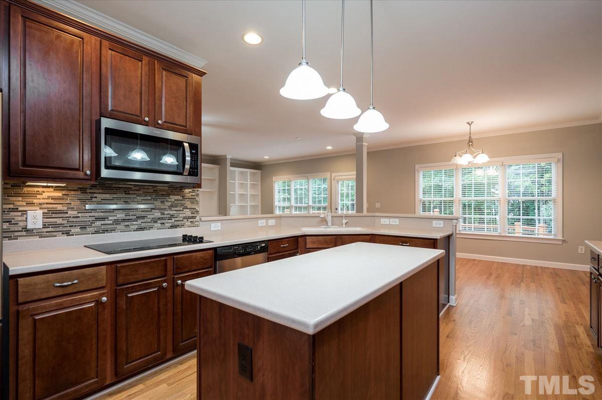 5245 Bartons Enclave Lane Raleigh, NC 27613 - Photo 4 of 27 Solid Surface countertops, New Cooktop, Stainless steel appliances including double ovens, and 42 inch cabinets with abundant storage and built in Pantry