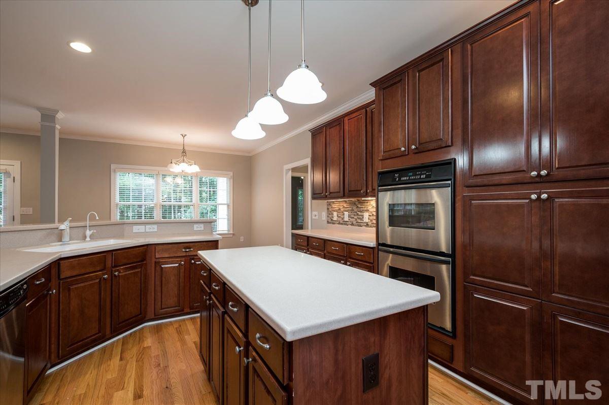 5245 Bartons Enclave Lane Raleigh, NC 27613 - Photo 6 of 27 Gorgeous tile backsplash and Kitchen Island perfect for prep