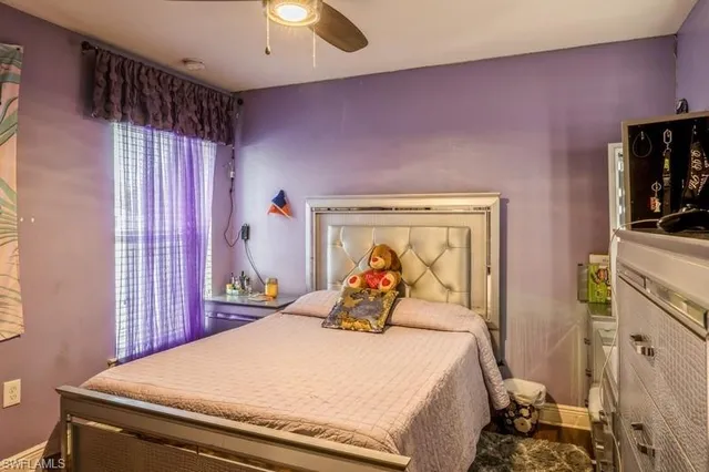 a bed room with a bed and a tv