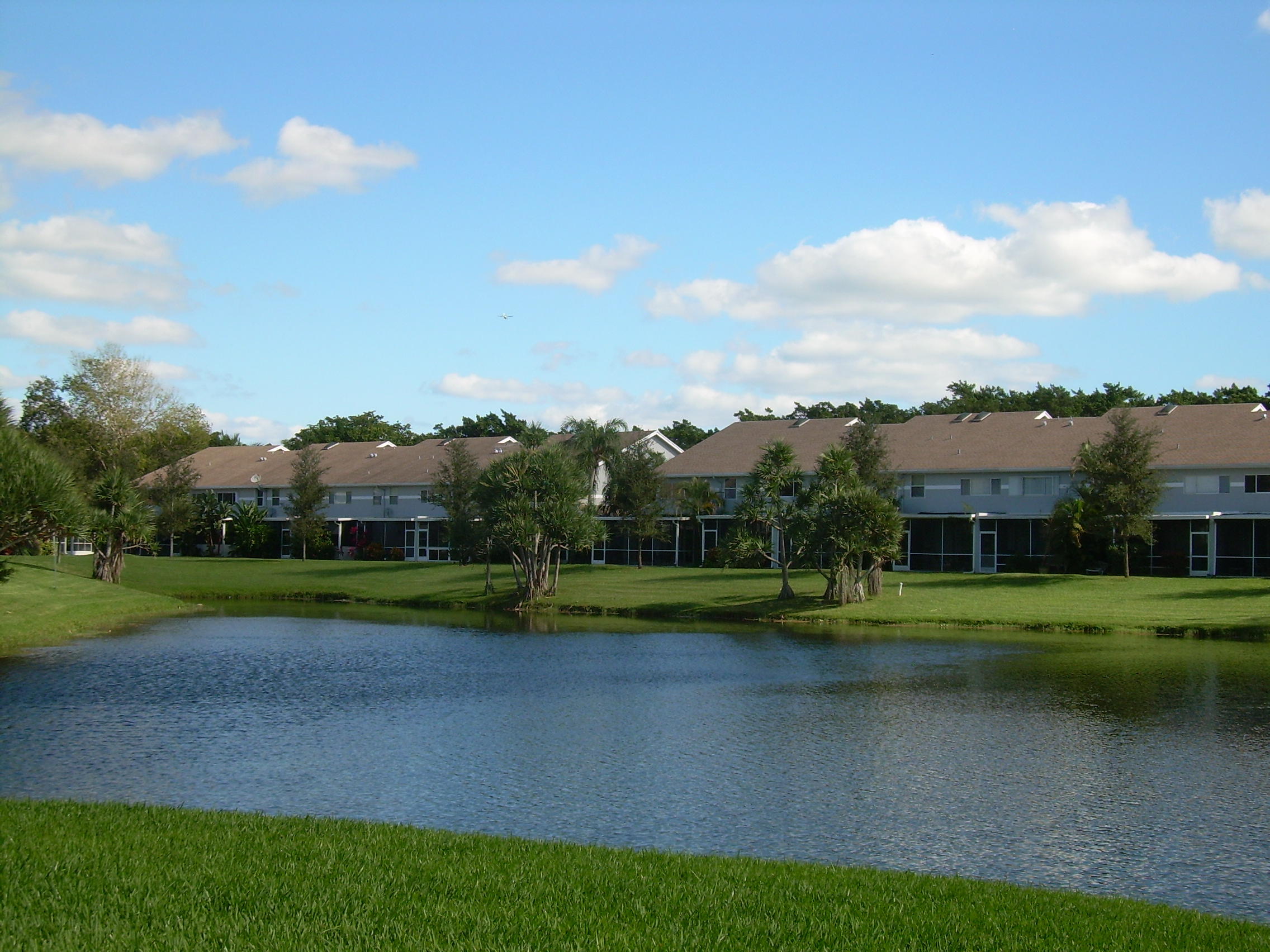 6053 Old Court Road, Unit 303 Boca Raton, FL 33433 - Photo 20 of 23 a view of a golf course with a lake
