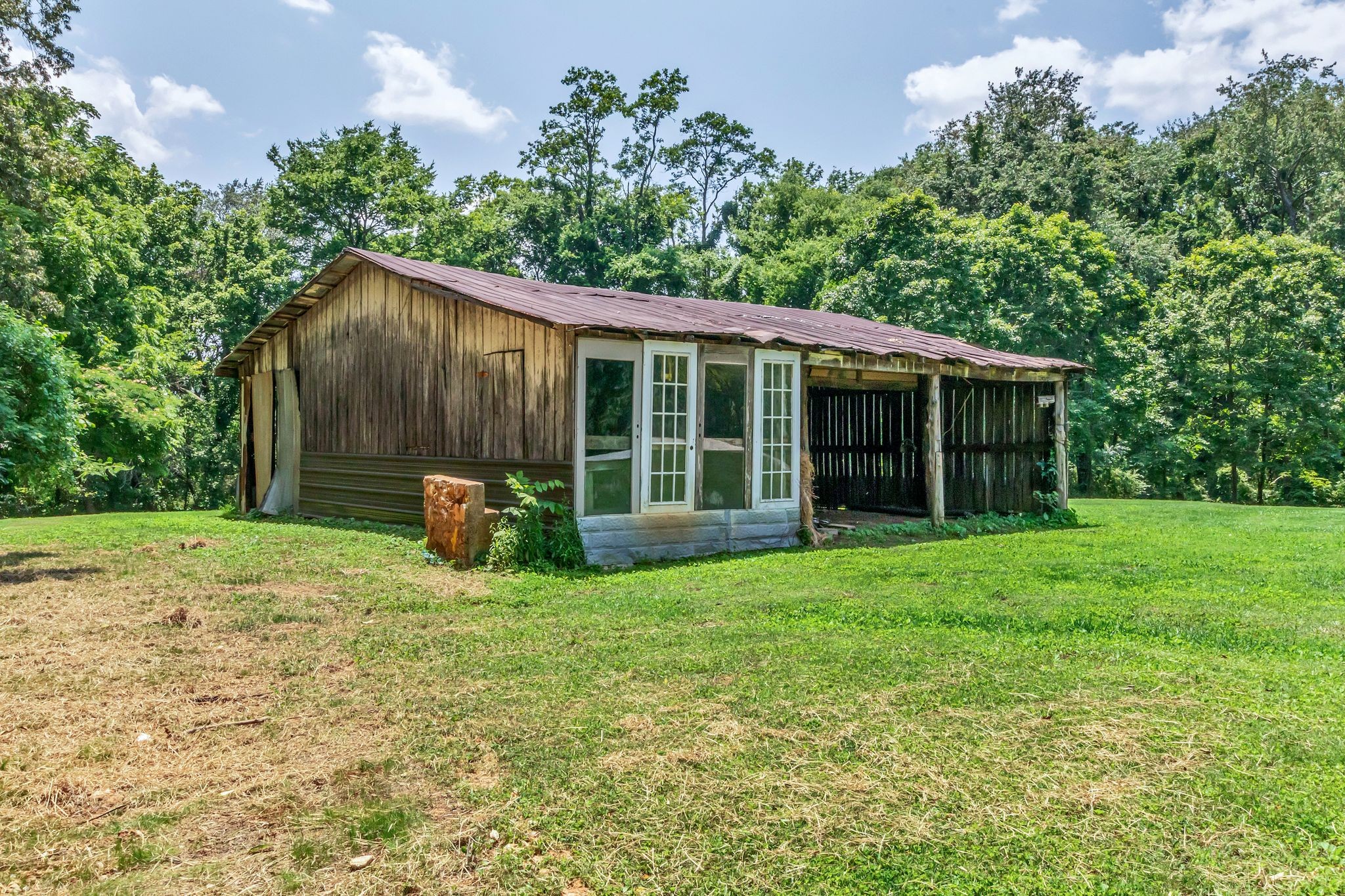 325 Francis Road Decherd, TN 37324 - Photo 23 of 27 a view of a house with yard and a garden