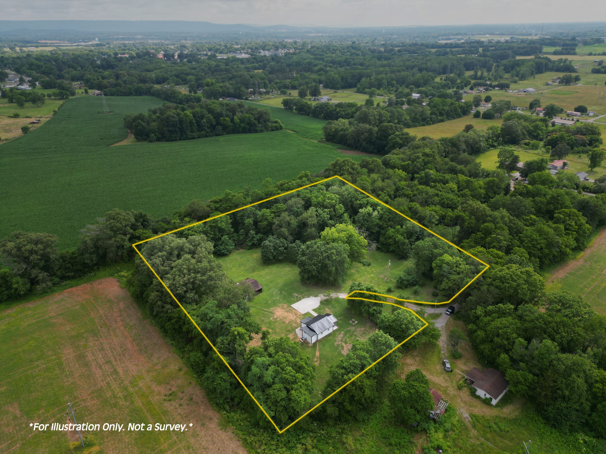 325 Francis Road Decherd, TN 37324 - Photo 27 of 27 an aerial view of a golf course with a lake view