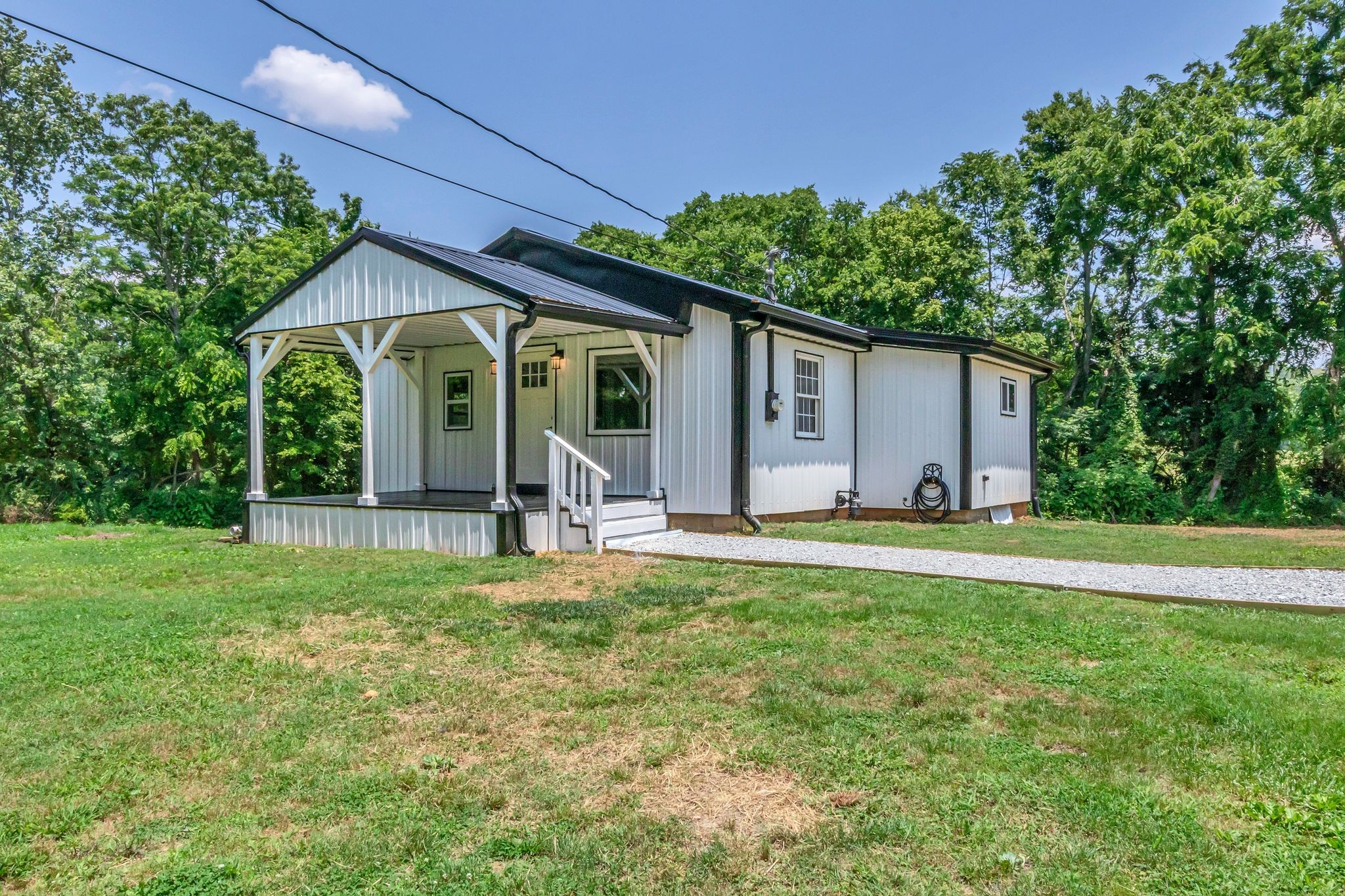 325 Francis Road Decherd, TN 37324 - Photo 3 of 27 a front view of house with yard and green space