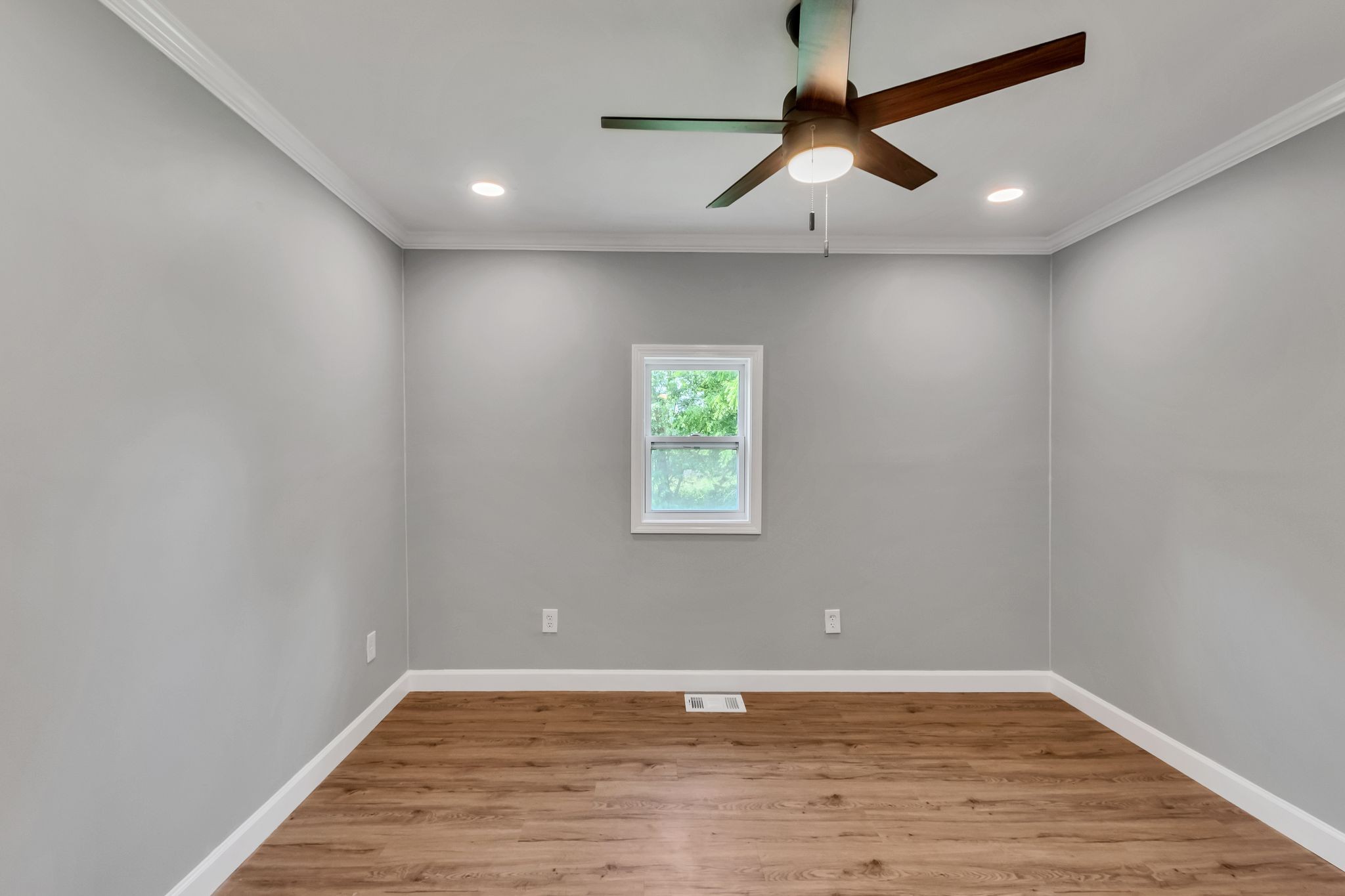 325 Francis Road Decherd, TN 37324 - Photo 10 of 27 a view of an empty room with window and wooden floor
