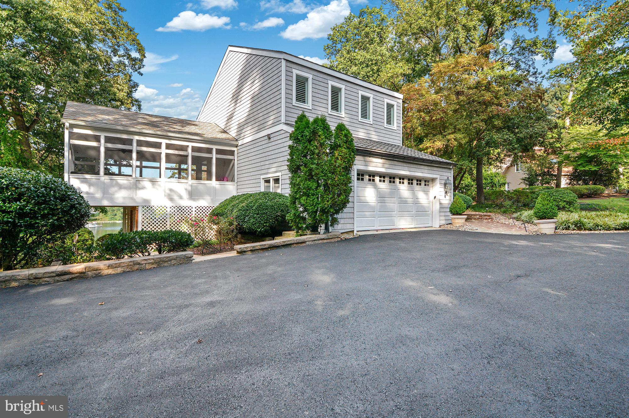 856 St Edmonds Place Annapolis, MD 21401 - Photo 103 of 129 a front view of a house with a yard and a garage