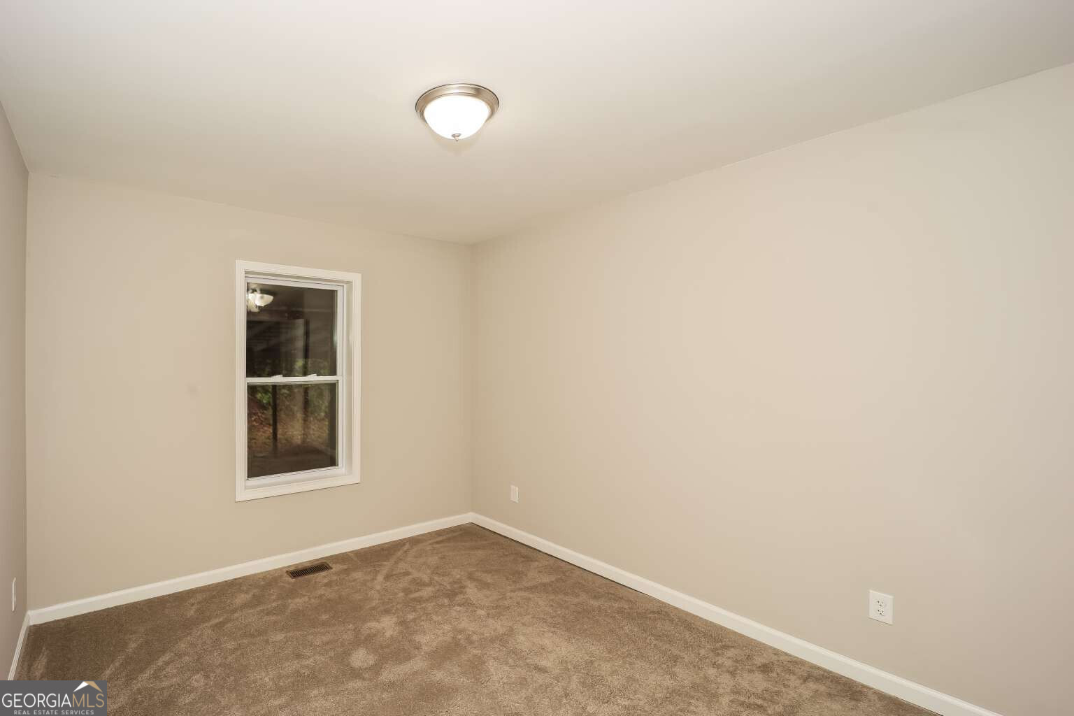 221 Power Plant Road Hogansville, GA 30230 - Photo 11 of 14 an empty room with a window