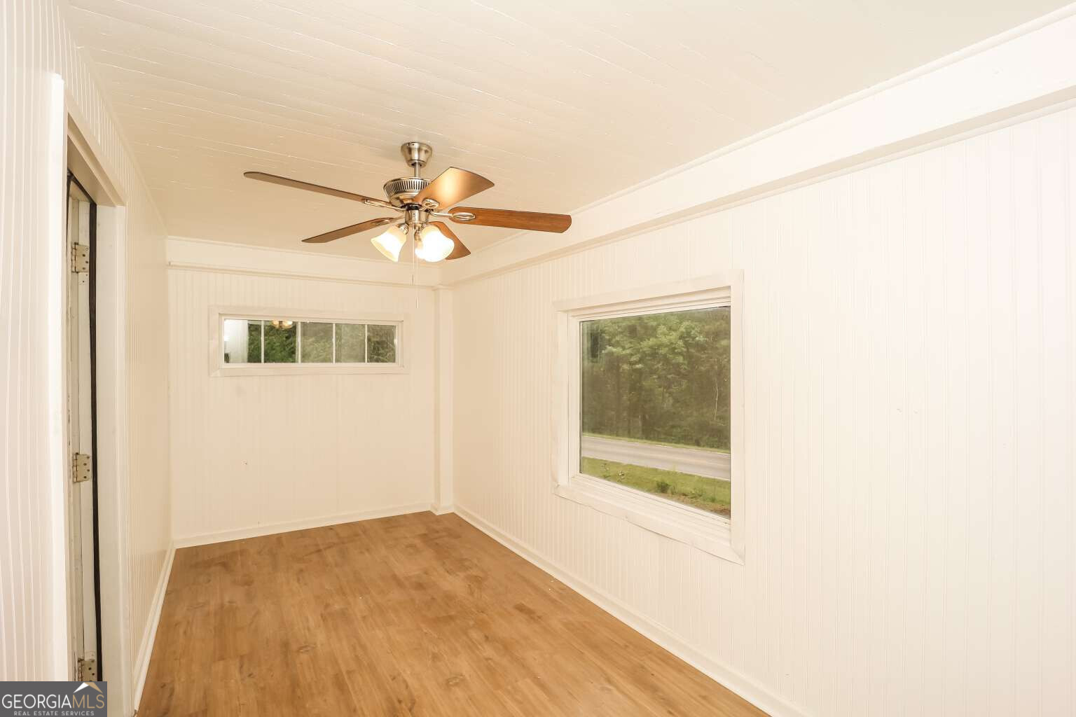 221 Power Plant Road Hogansville, GA 30230 - Photo 13 of 14 a view of a room with a ceiling fan and a window