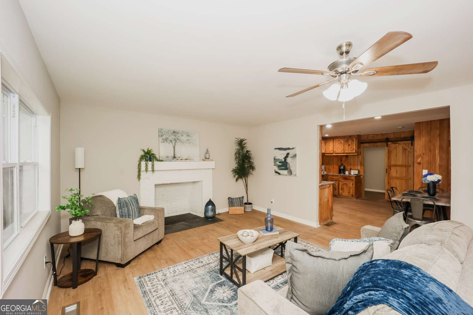 221 Power Plant Road Hogansville, GA 30230 - Photo 4 of 14 a living room with furniture and a chandelier