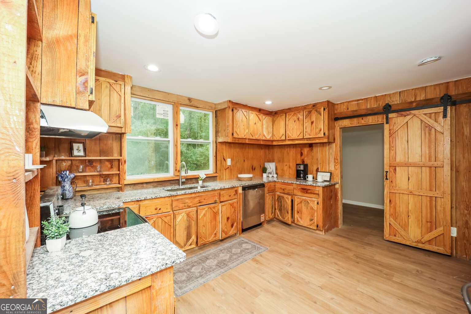 221 Power Plant Road Hogansville, GA 30230 - Photo 5 of 14 a kitchen with stainless steel appliances granite countertop a stove and a refrigerator