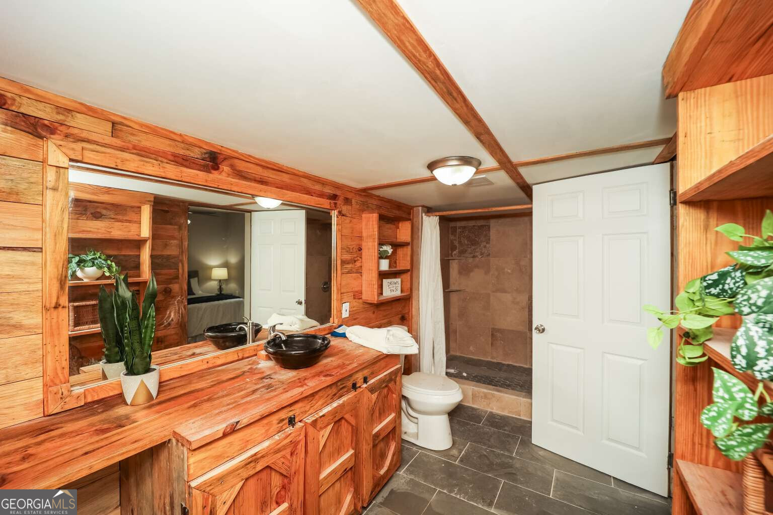 221 Power Plant Road Hogansville, GA 30230 - Photo 8 of 14 a bedroom with a bed and a large mirror