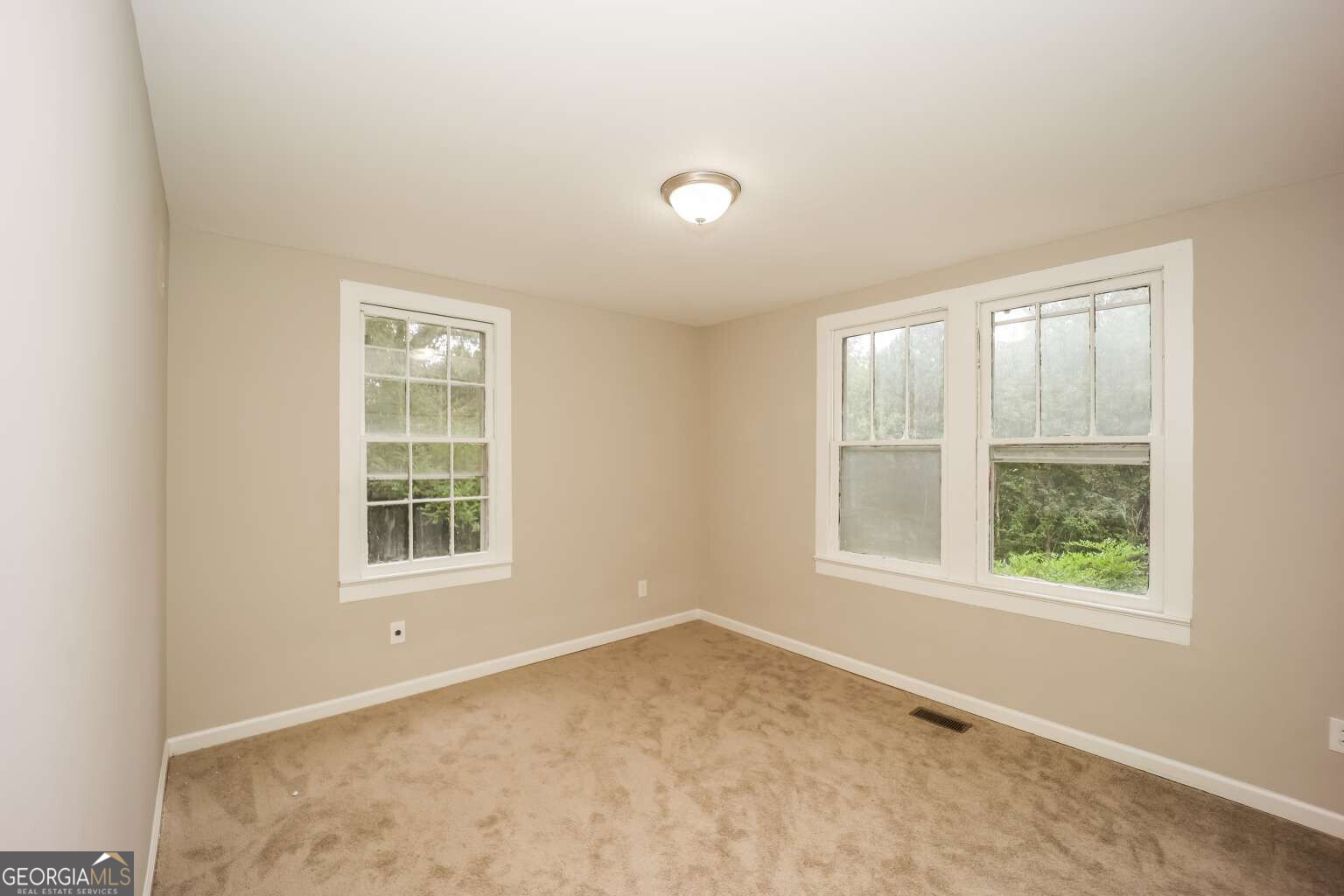 221 Power Plant Road Hogansville, GA 30230 - Photo 9 of 14 an empty room with a window