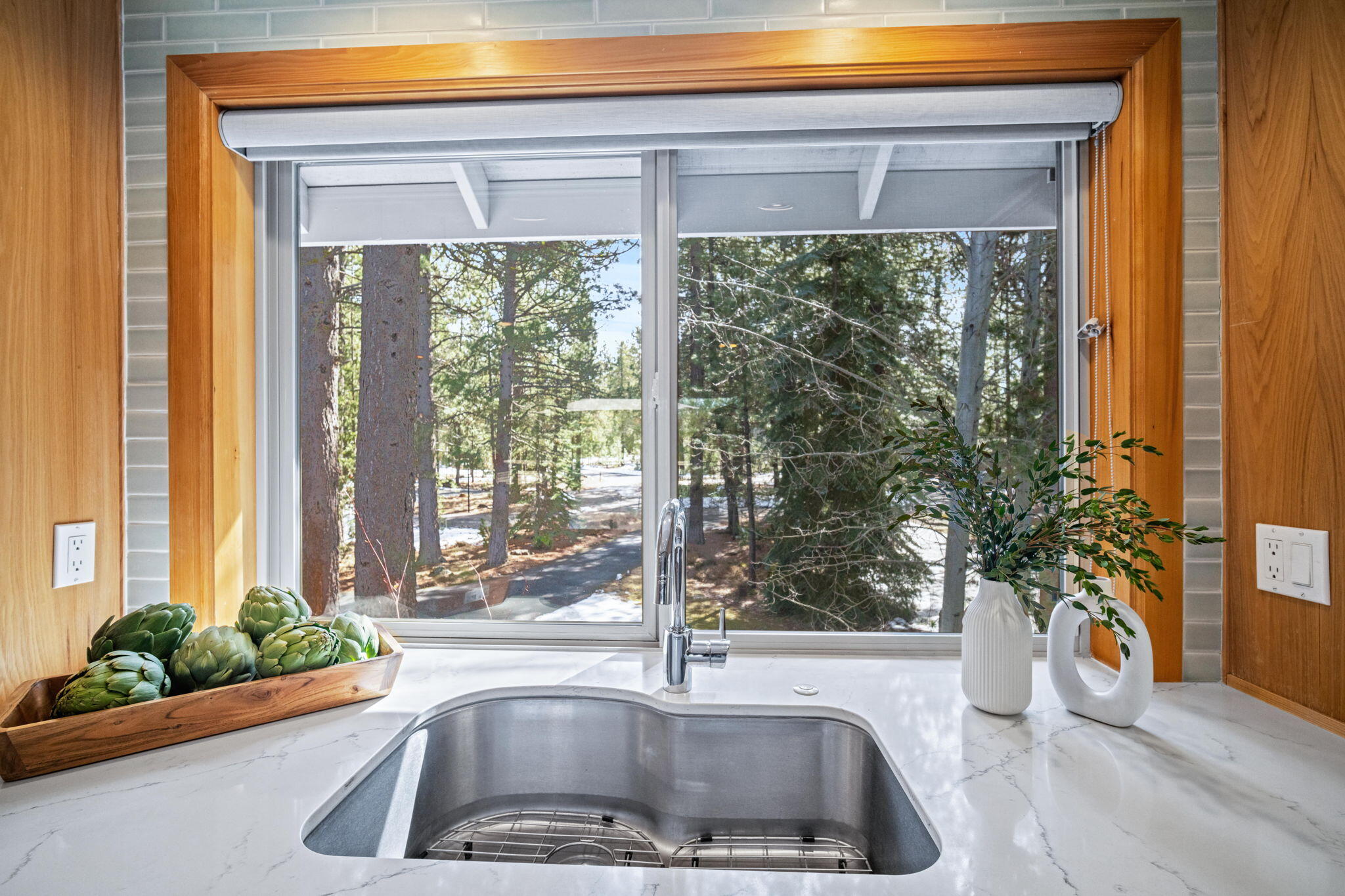 17948 Shadow Lane, Unit 7 Sunriver, OR 97707 - Photo 30 of 92 a kitchen with a sink and garden view
