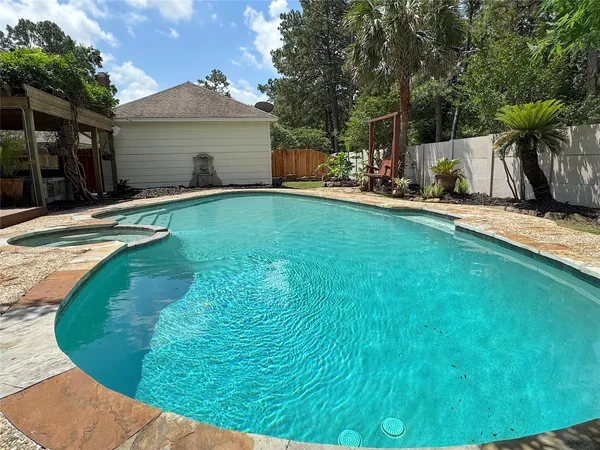 a view of a house with a yard porch and sitting area