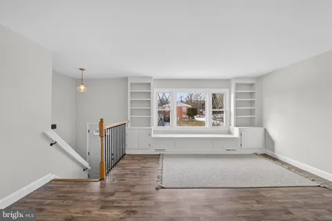 a kitchen with stainless steel appliances granite countertop a stove and cabinets