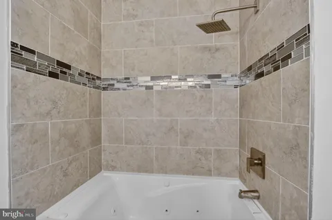 a bathroom with a sink and mirror with toilet