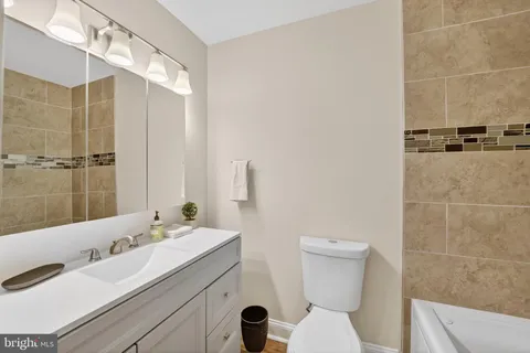 a view of a room with wooden floor and window