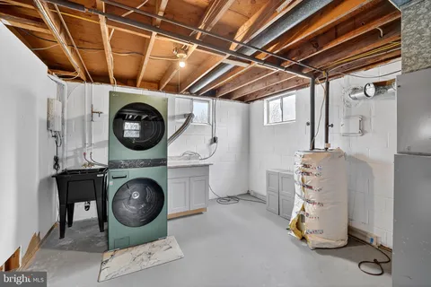 a view of a room with wooden floor and window