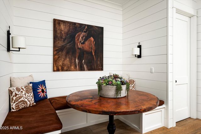 a living room with furniture windows and a chandelier