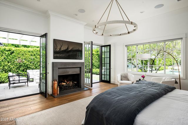 a bathroom with a granite countertop sink mirror and a shower