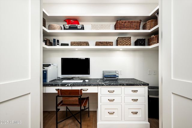 a living room with furniture flat screen tv and a window
