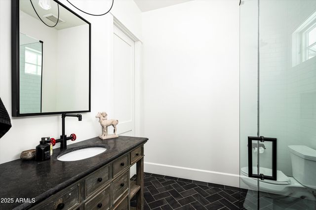 a utility room with sink dryer and washer