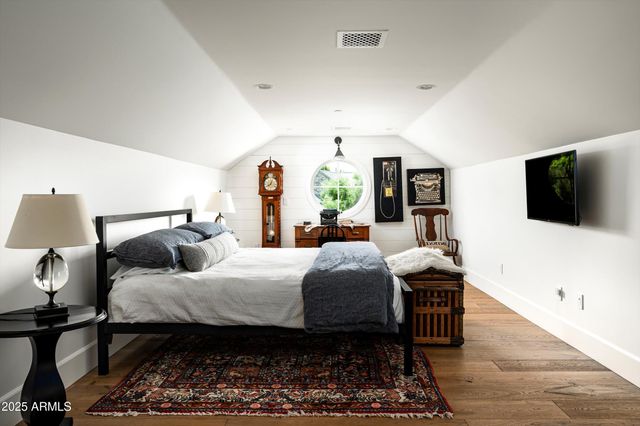 a balcony with table and chairs