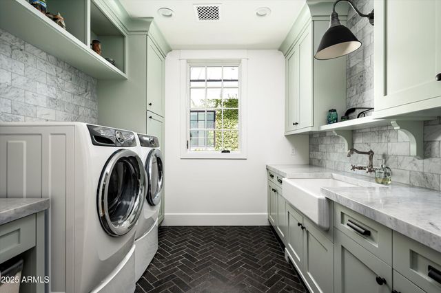 a view of a patio with a table chairs and a swimming pool