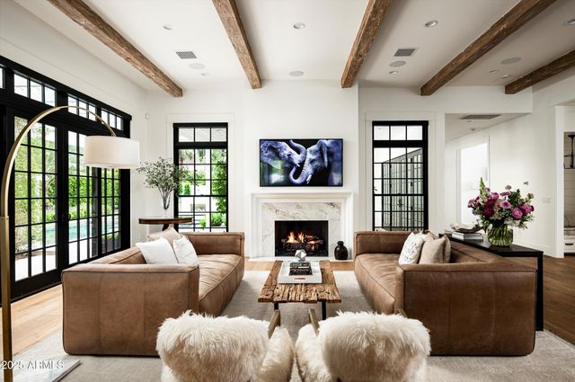 a kitchen with stainless steel appliances a kitchen island a stove a table and chairs in it