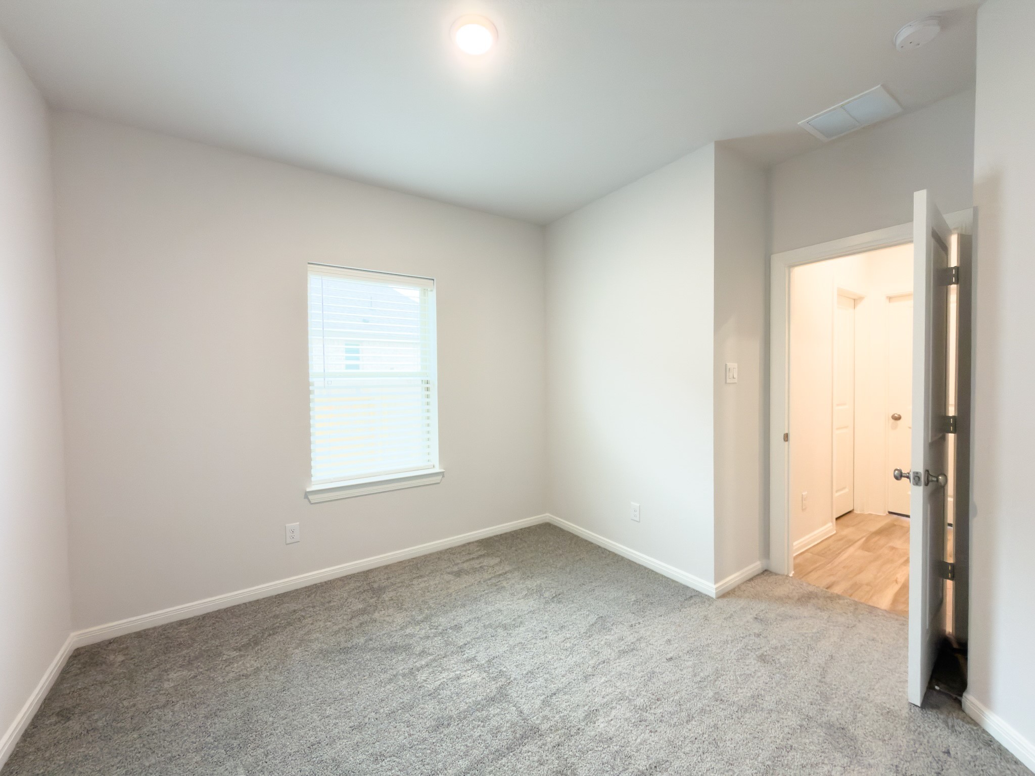 42504 Rustico Road Magnolia, TX 77354 - Photo 21 of 46 an empty room with windows and closet
