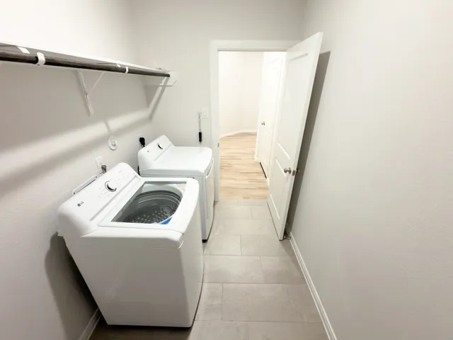 a utility room with dryer and washer