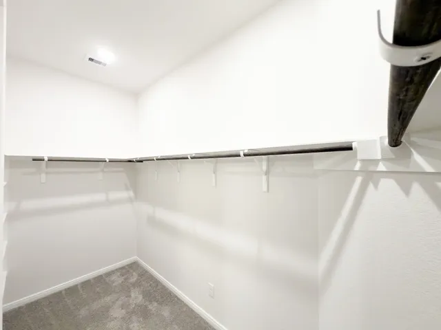 a view of a room with racks on the wall