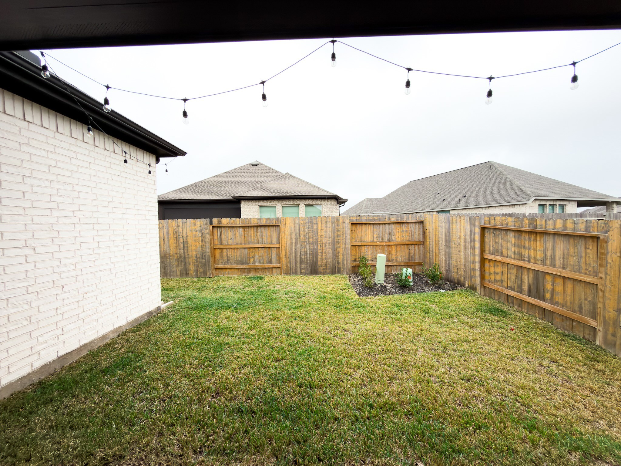 42504 Rustico Road Magnolia, TX 77354 - Photo 46 of 46 a view of a backyard with a garden and deck