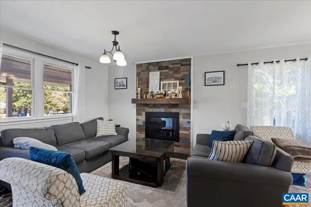 a kitchen with stainless steel appliances a sink cabinets and a window
