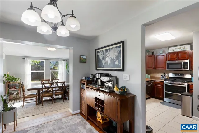 a kitchen with stainless steel appliances granite countertop a stove and a microwave