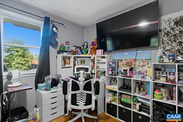 a bathroom with a shower curtain and a sink