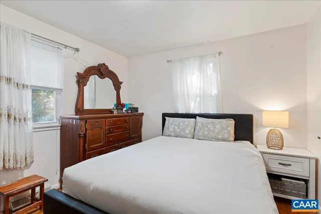 a bathroom with a sink a mirror and a toilet