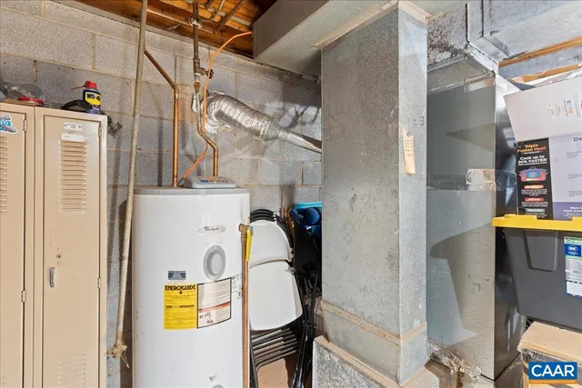 a view of a patio with couches chairs and wooden floor