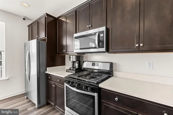 a view of kitchen island with furniture and wooden floor