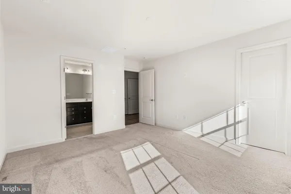 a bathroom with double sink and a mirror