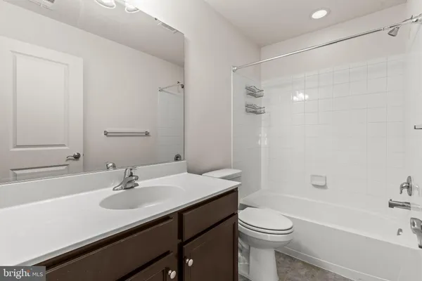 a close view of a utility room with dryer and washer