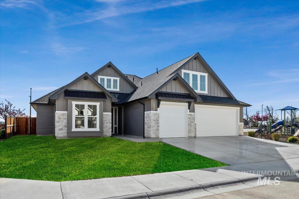 232 South Fusion Avenue Kuna, ID 83634 - Photo 2 of 50 Craftsman-style home featuring board and batten siding, concrete driveway, a shingled roof, and a garage