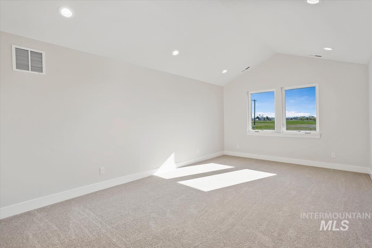 232 South Fusion Avenue Kuna, ID 83634 - Photo 32 of 50 Unfurnished room with light carpet and recessed lighting