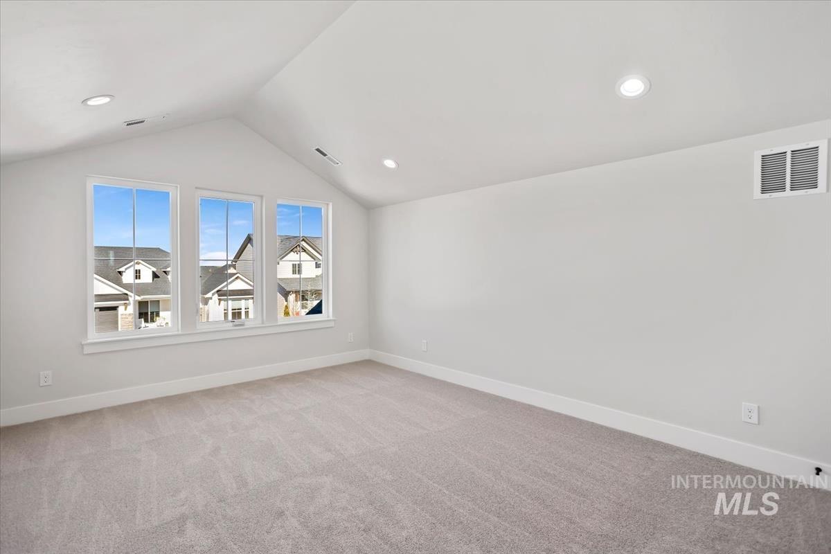232 South Fusion Avenue Kuna, ID 83634 - Photo 33 of 50 Additional living space with light colored carpet and recessed lighting