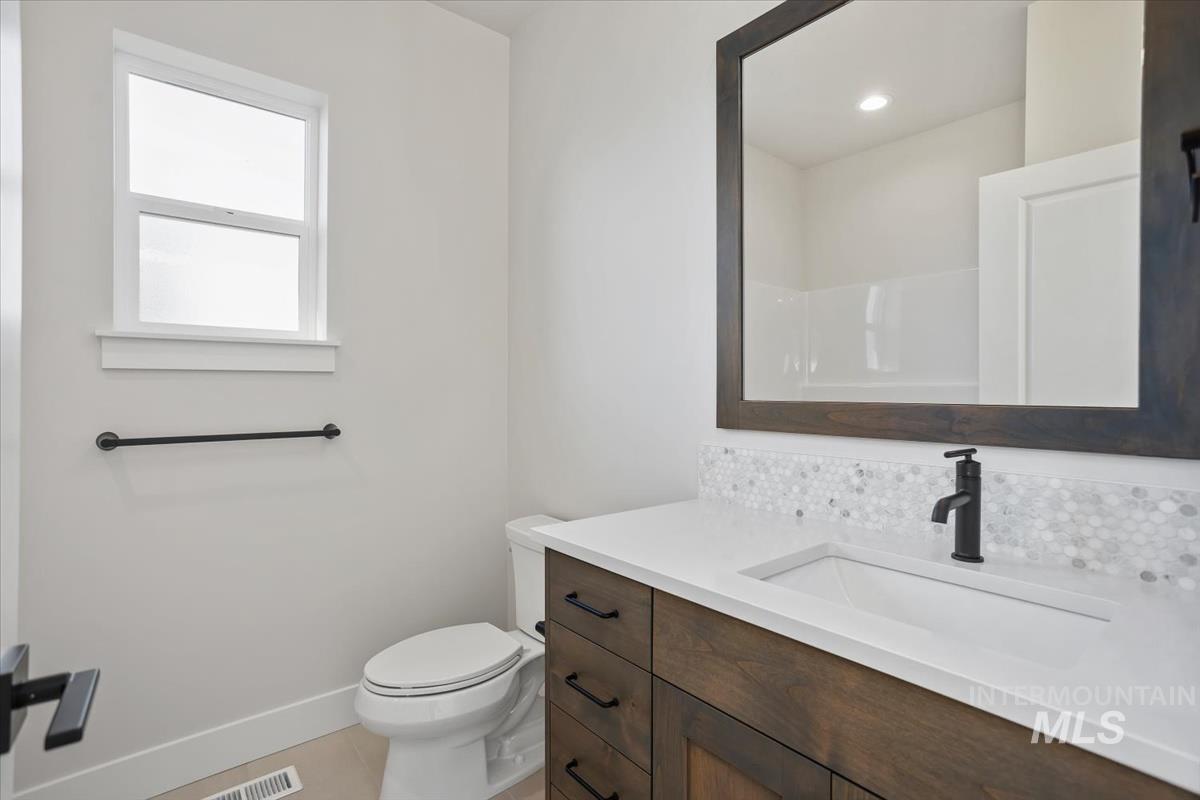 232 South Fusion Avenue Kuna, ID 83634 - Photo 37 of 50 Full bathroom featuring vanity and toilet