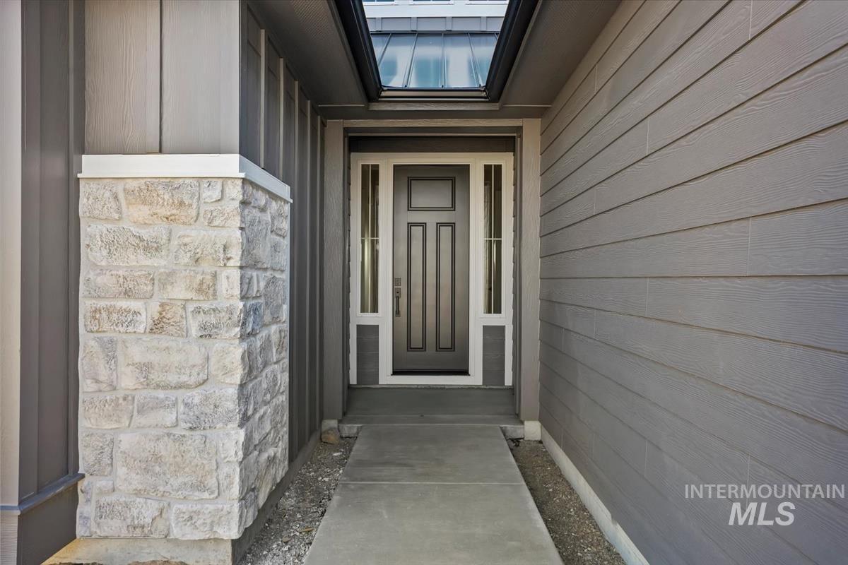 232 South Fusion Avenue Kuna, ID 83634 - Photo 4 of 50 Property entrance with stone siding